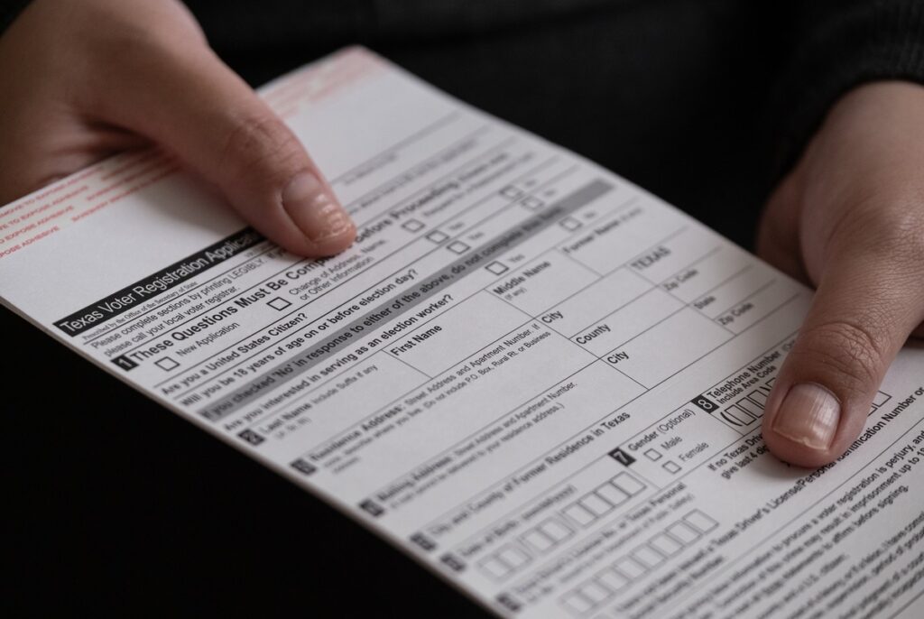 Ken Paxton sues Travis County to block voter registration efforts