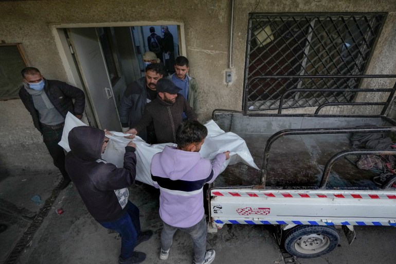 At a Syria morgue, people search for loved ones killed by Assad regime