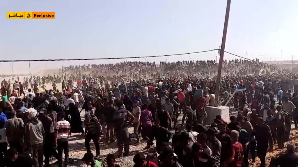 Chaos erupts as Palestinians rush to aid site after months of blockade