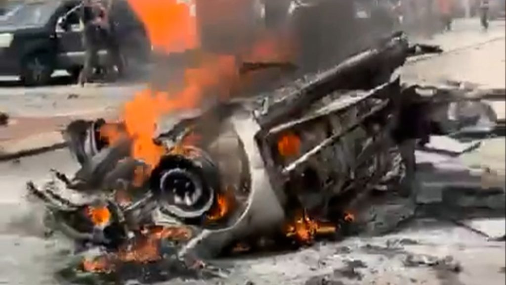 Vehicles burn in Israel after being hit with Iranian projectile debris