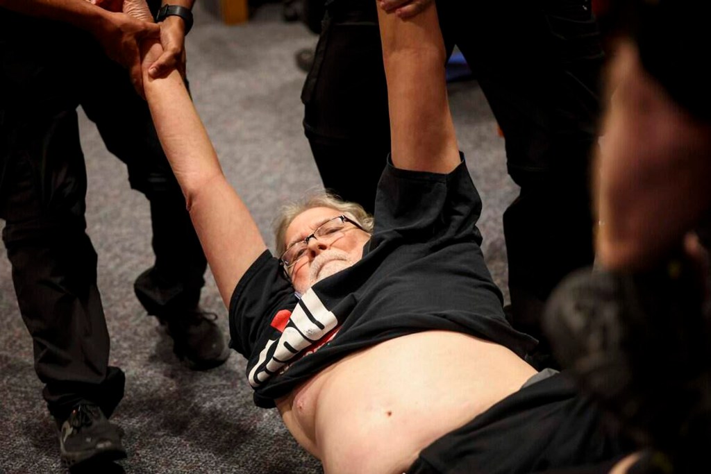 Former state Rep. Lon Burnam eyes lawsuit after arrest during meeting on voting site cuts