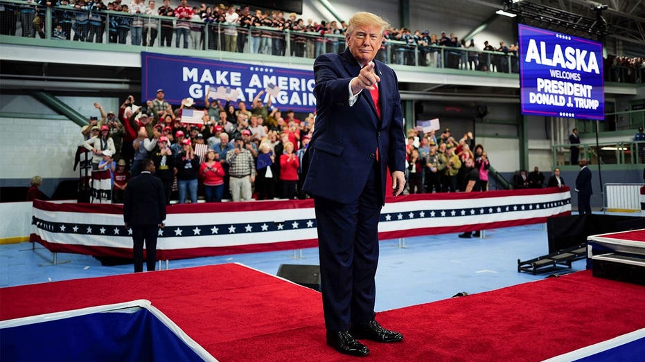 Trump signs pardons for Alaska diesel mechanics onstage during rally touting major energy deals Trump signs pardons for Alaska diesel mechanics onstage during rally touting major energy deals
