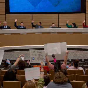 A Texas school leader says material about diversity in state-approved textbooks violated the law.
