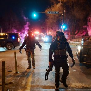 ICE officer in Texas-Minnesota fight turns himself in to face shooting charges, AP reports
