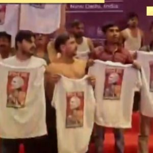 Watch Video: After robodog row, shirtless men at AI Impact Summit 2026, Youth Congress members protest outside venue