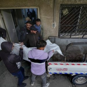 At a Syria morgue, people search for loved ones killed by Assad regime