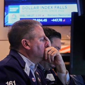 US stocks and dollar tumble as Trump renews attacks on Fed Chair Powell