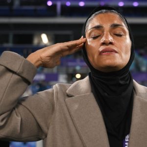 Iran women’s football team sing anthem amid safety concerns during war