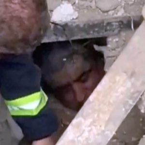 Moment rescuers find man alive under the rubble in Tehran