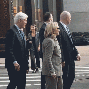 Hillary Clinton caught on video stepping back after pushy former president nudges her at busy NYC intersection