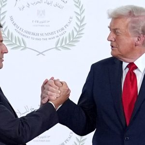 Watch Trump and France’s Macron share weirdly long 26-second marathon handshake