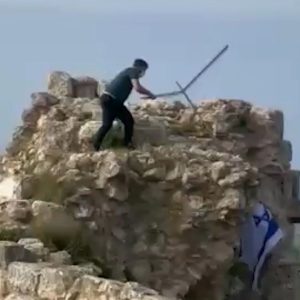 Lebanese man removes Israeli flag from castle in southern Lebanon