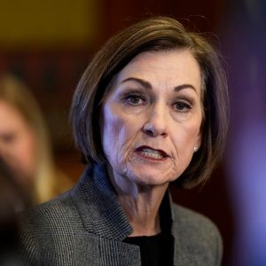Iowa governor signs bill removing transgender protections from civil rights code