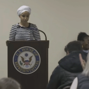 Ilhan Omar sprayed by unknown substance after man charges her at Minneapolis town hall