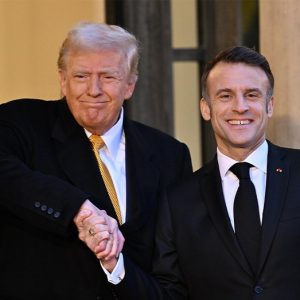 Social media reacts to Trump ‘dominating world leaders’ with Macron handshake during meeting in France